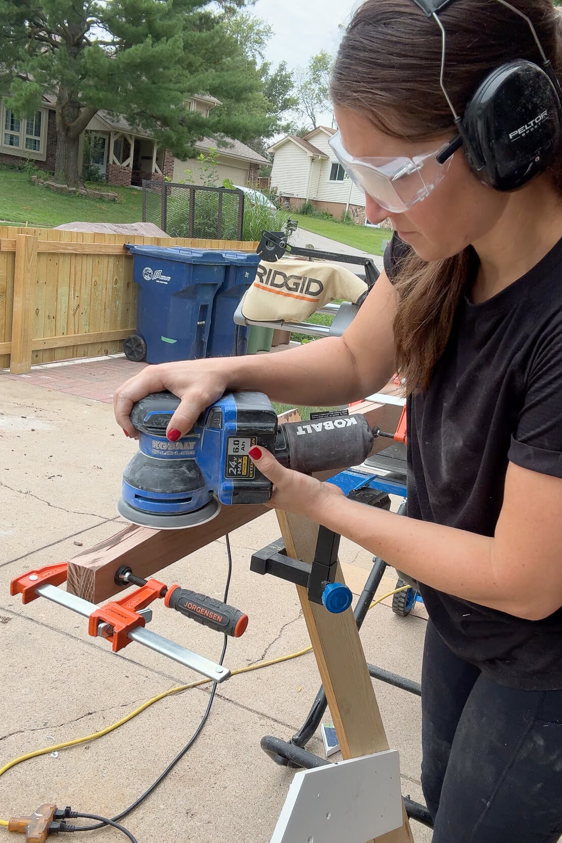 Sanding a piece of my DIY bunk bed ladder.